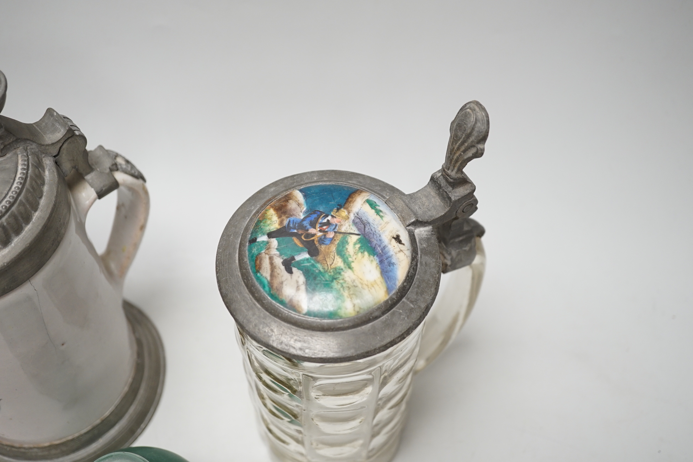 A German faience stein, dated 1819, a glass stein and an inkwell, largest 24cm